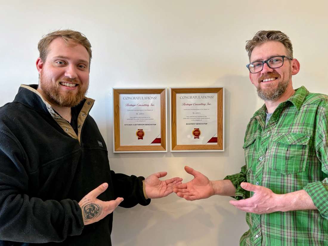 Reshape Consulting directors Brandon Whittle and Mark Tulk beside their framed 2026–2027 Consumer Choice Awards for the St. John's region.