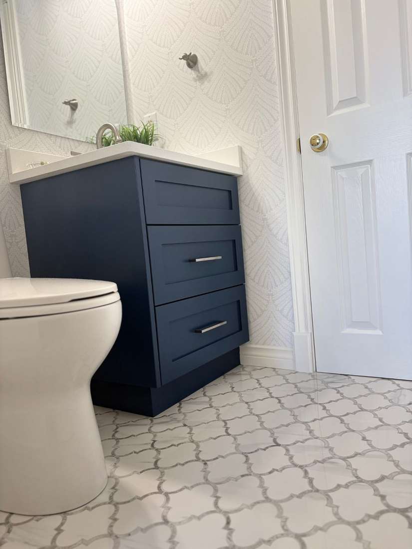 Kensington powder room — custom navy vanity detail.