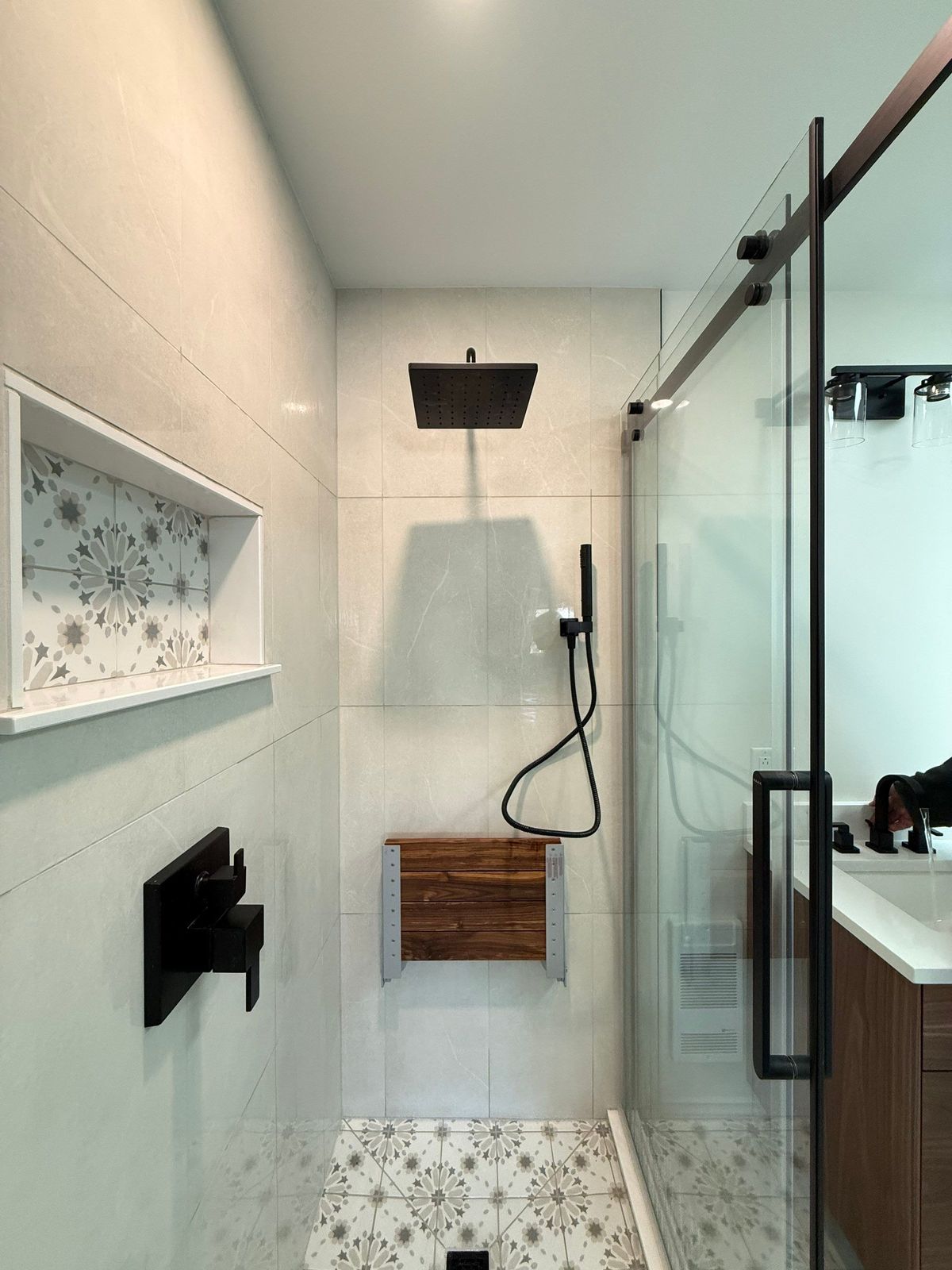 Baker Street finished shower with rain head and teak fold-down seat.