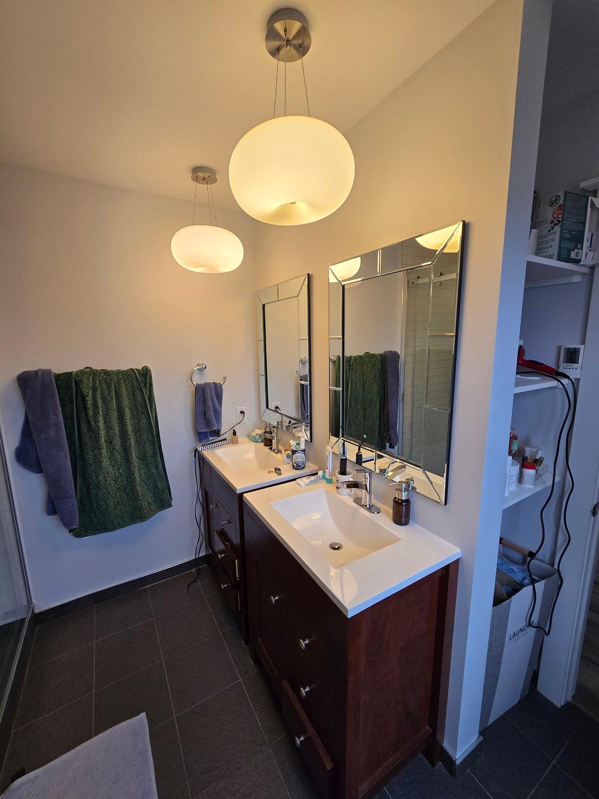 Newtown Road bathroom before renovation — the original double vanity.