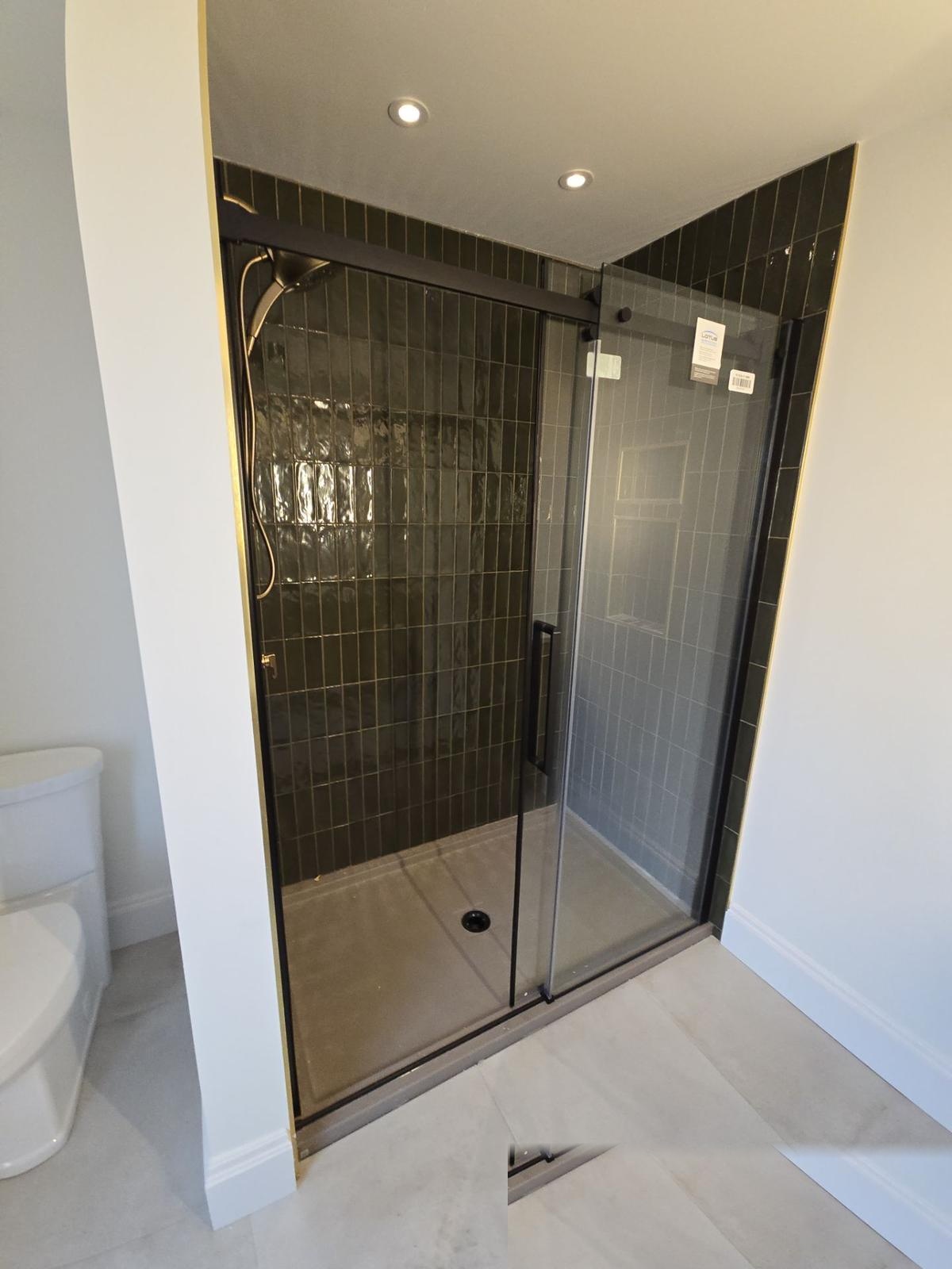 Newtown Road — dark green tile walk-in shower.