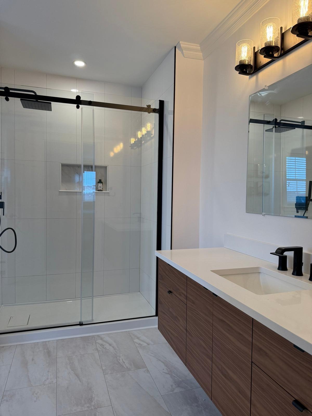 Motion Lane — finished walk-in shower and vanity.