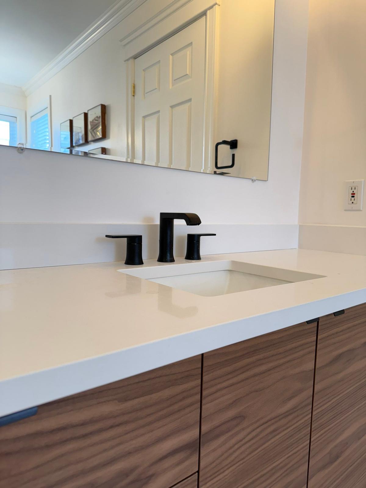 Motion Lane — matte black faucet detail.