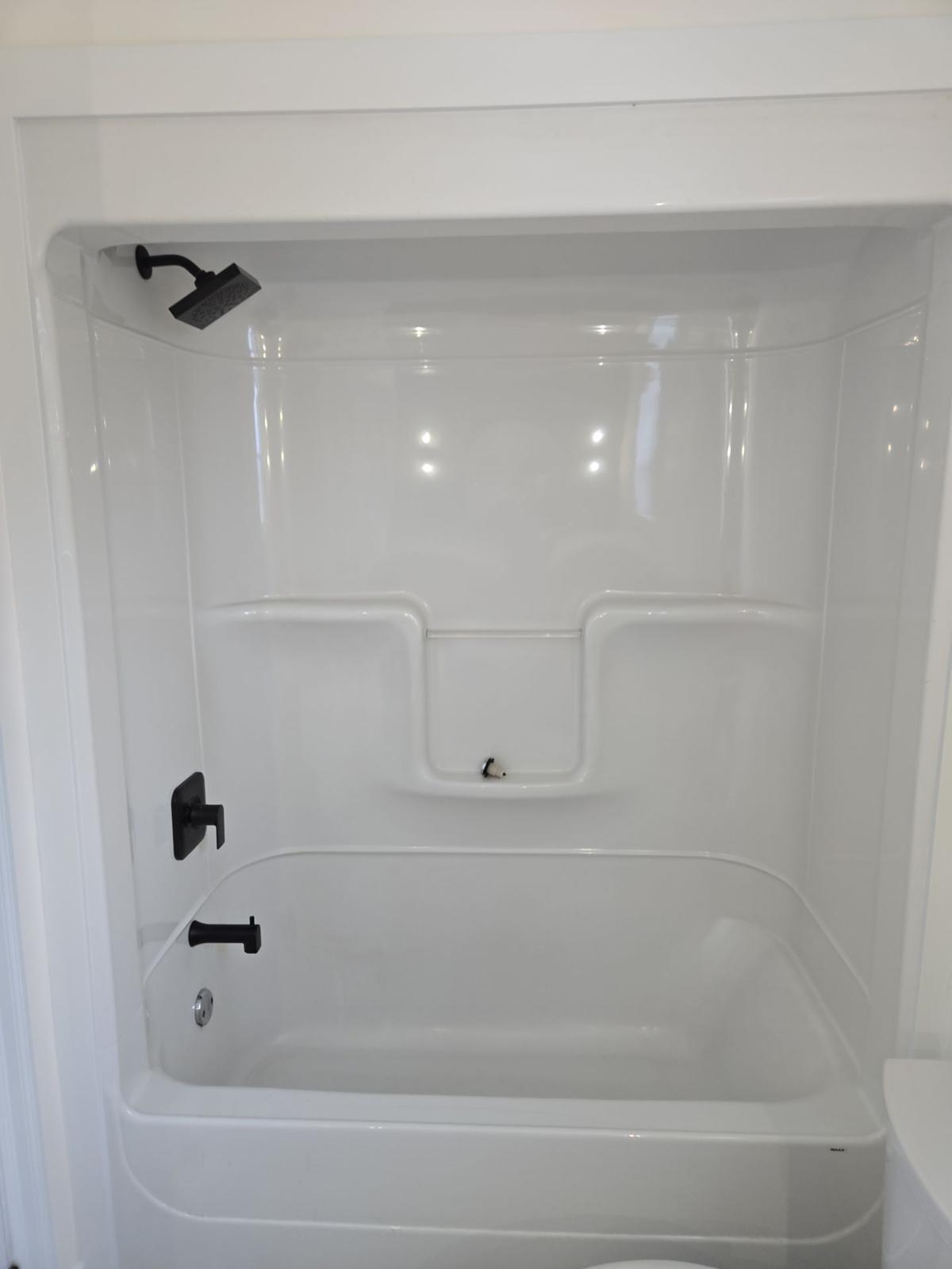 Motion Lane — finished tub and shower detail.