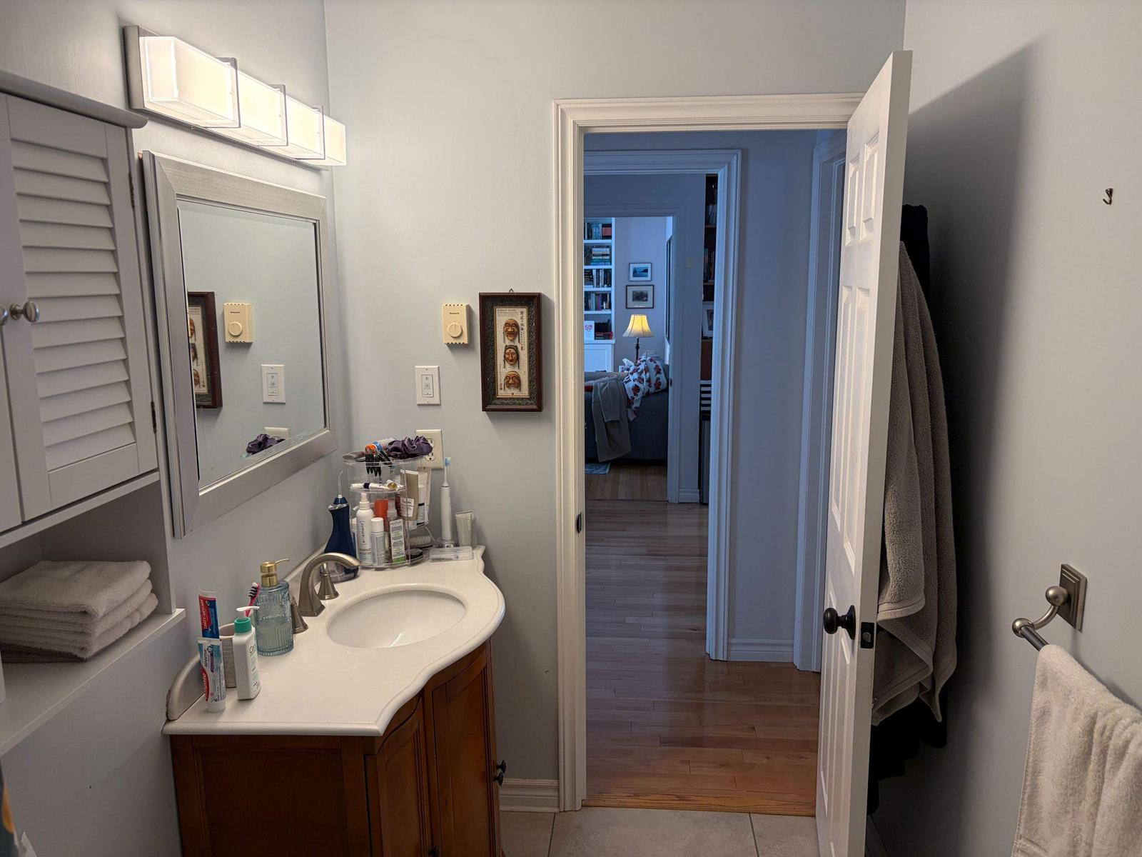 Ranger Avenue bathroom before renovation — vanity and original finishes.